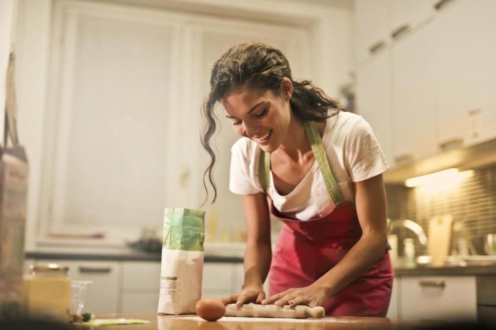 Professional preparing a quick meal in a modern kitchen, showcasing time-saving cooking tips.