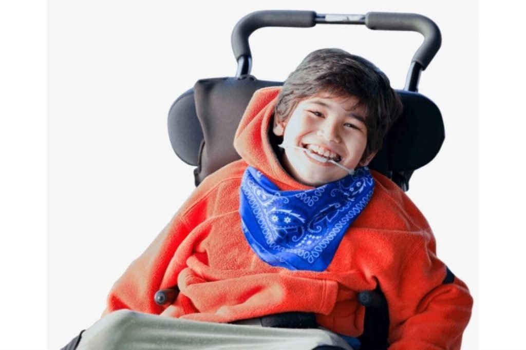 Some Facts on Children with Cerebral Palsy and Autism and Effective Strategies for Parents A young child with cerebral palsy and autism engaging in a sensory activity with a caregiver’s support.