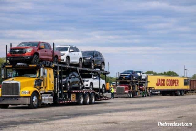 Jack Cooper car carrier truck transporting vehicles