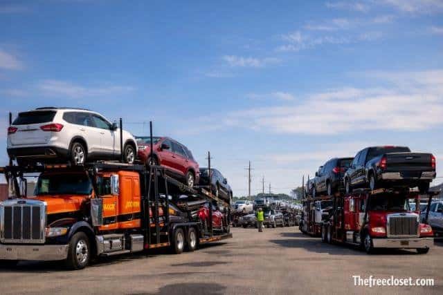 Jack Cooper Transport car hauler trucks at terminal